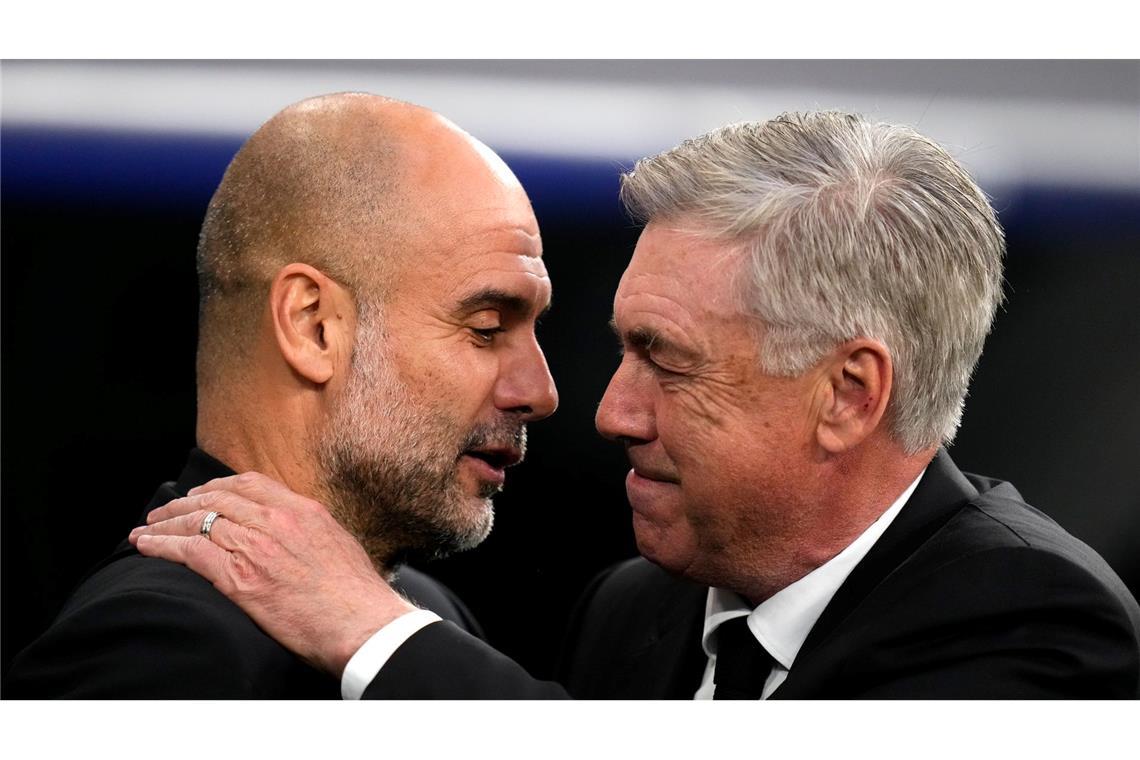 Beide Trainer zeigten sich mit dem Unentschieden zufrieden: Manchesters Pep Guardiola (l) und Madrids Carlo Ancelotti (Archivbild).