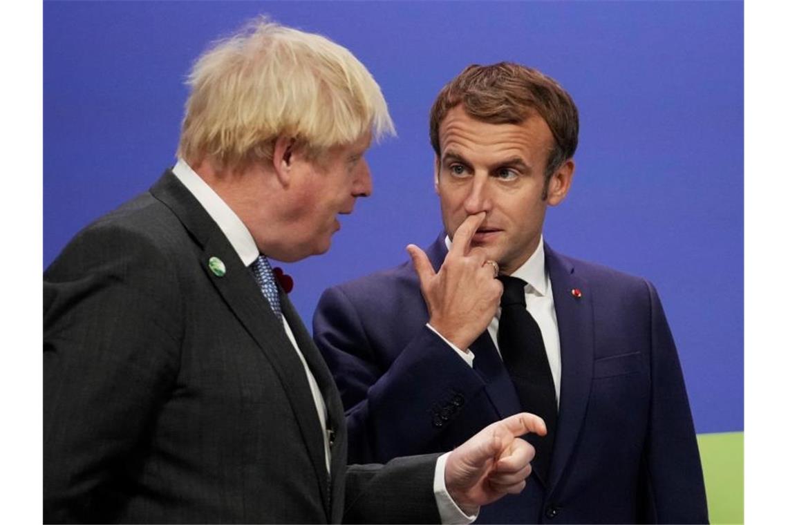 Johnson ärgert Paris mit Brief zu Migrationskrise Der britische Premierminister Boris Johnson (l.) Frankreichs Präsidenten Emmanuel Macron. Foto: Christopher Furlong/Getty/AP/dpa/Archiv