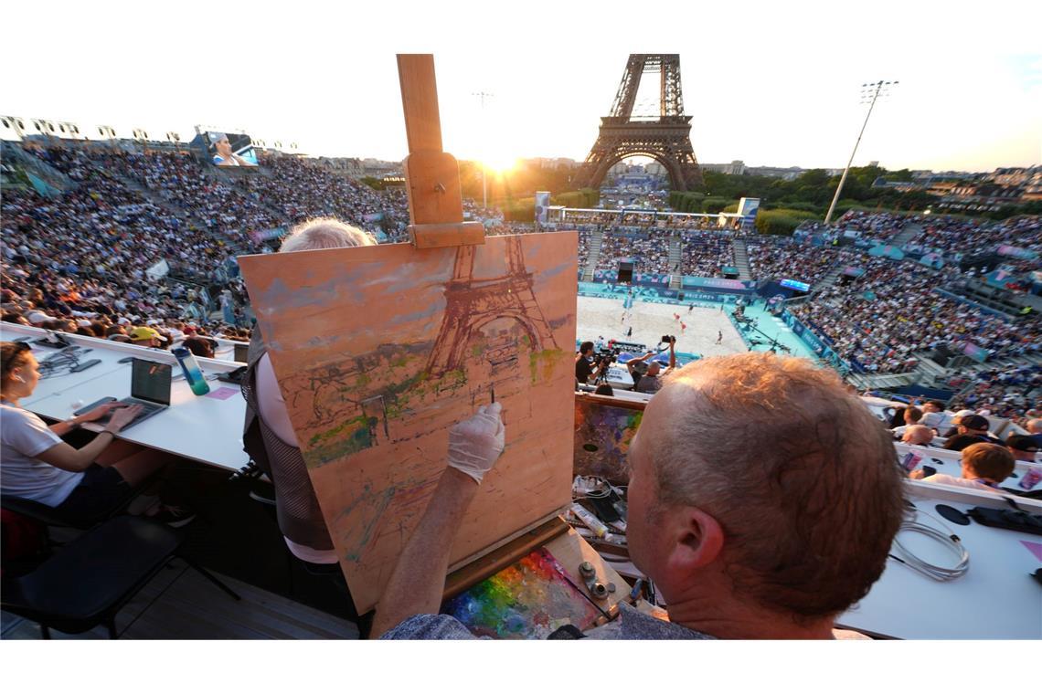 Peter Spens malt beim Beach-Volleyball den Eifelturm und das Eiffel Tower Stadium.