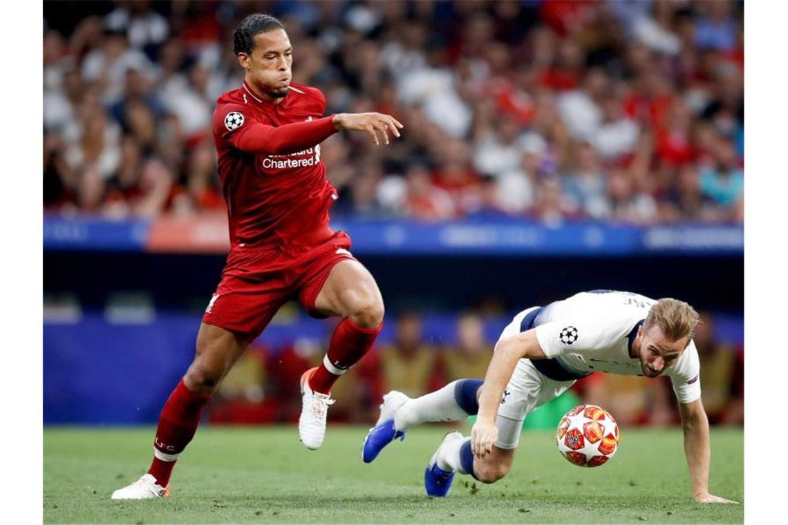 Klopp führt Liverpool gegen Tottenham auf Europas Thron Tottenham-Star Harry Kane hat gegen Virgil van Dijk (l) das Nachsehen. Foto: Martin Rickett/PA Wire